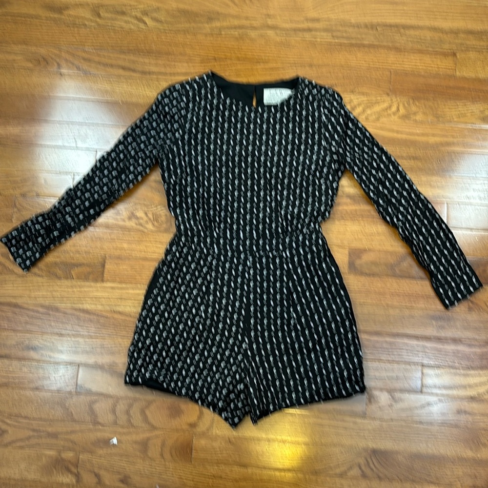 Never been worn!Jack Wills. Black, long sleeve romper with zipper back. Size 4